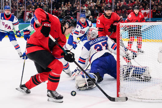 Macklin Celebrini of Canada against Jaccob Slavin and