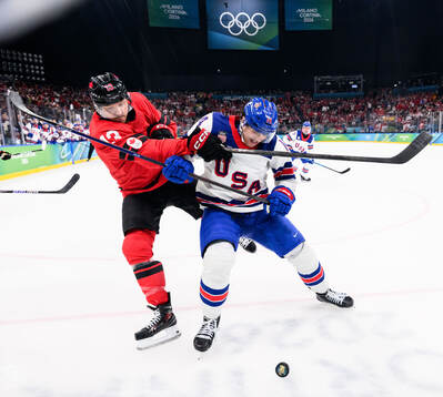 Sam Reinhart of Canada and Brock Faber of USA in the men's