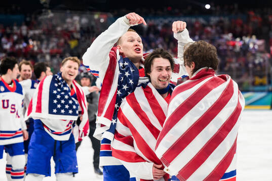 Brady Tkachuk and Quinn Hughes and Jack Hughes of USA
