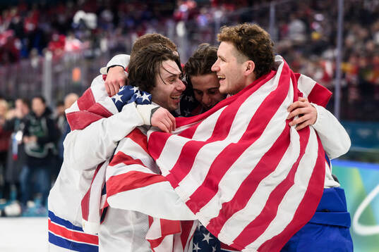 Quinn Hughes, Jack Hughes and Matthew Tkachuk of USA