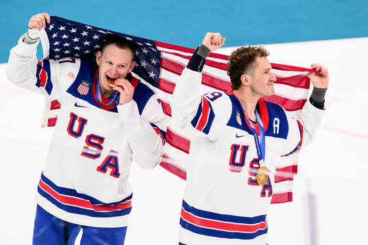 Brady Tkachuk and Matthew Tkachuk of USA celebrate