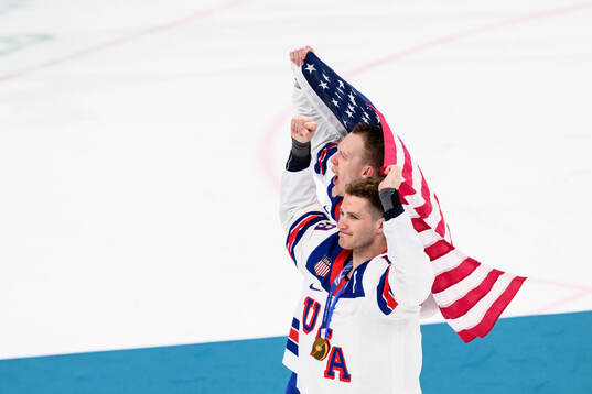 Brady Tkachuk and Matthew Tkachuk of USA celebrate