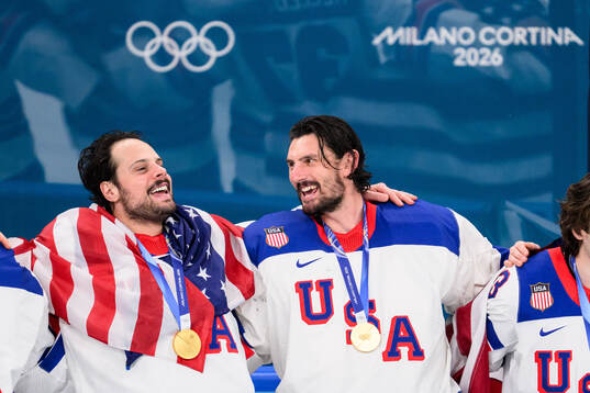 Auston Matthews and goaltender Connor Hellebuyck of USA