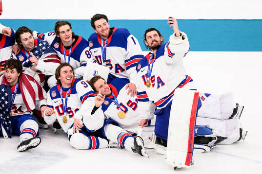 Jack Hughes, Jeremy Swayman and goaltender Connor