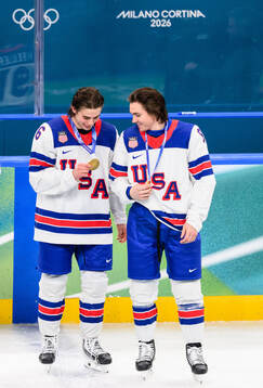 Jack Hughes and Clayton Keller of USA with their gold medals