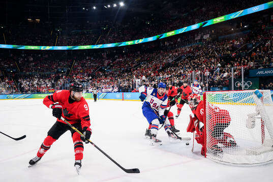 Matthew Tkachuk of USA against Sam Bennett, Cale Makar and