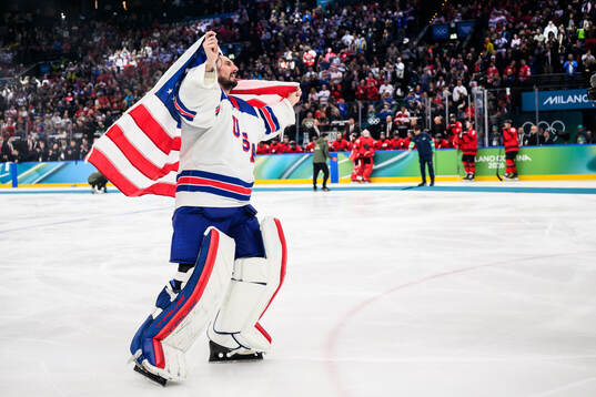 Goaltender Connor Hellebuyck of USA celebrates