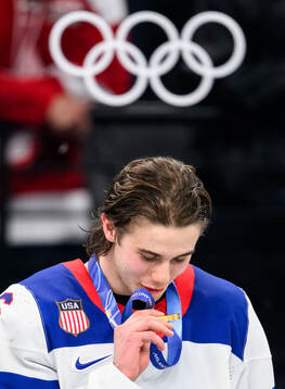 Jack Hughes of USA celebrates with his gold medal