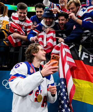 Jack Hughes of USA celebrate with fans
