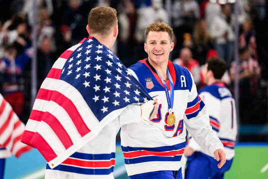 Brady Tkachuk and Matthew Tkachuk of USA celebrate