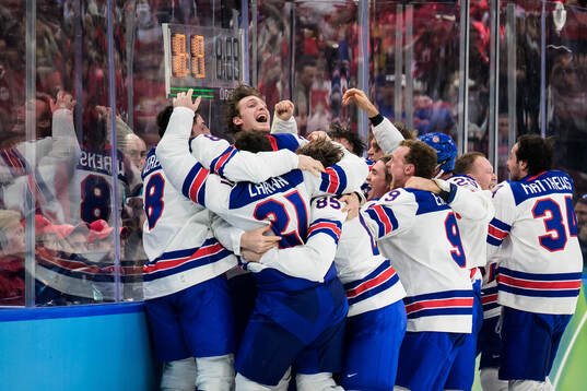 Players of USA celebrate the game-winning 1-2 goal by Jack