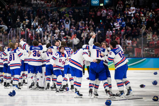 Jack Hughes of USA celebrates with teammates the