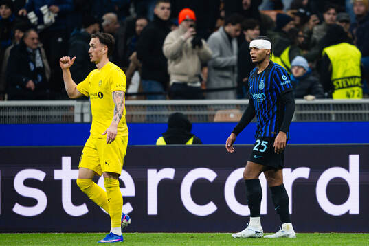 Andreas Helmersen of Bodø/Glimt and Manuel Akanji of Inter