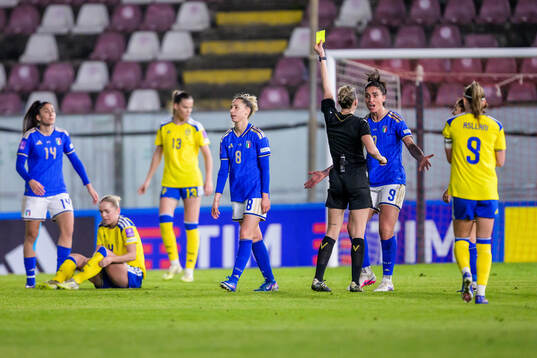 Martina Piemonte of Italy receives a yellow card