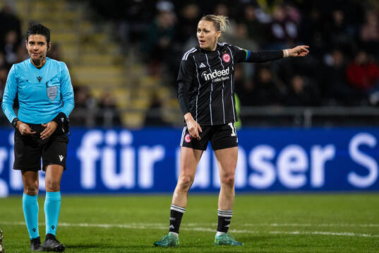 Referee Catarina Campos and Marthine Østenstad of