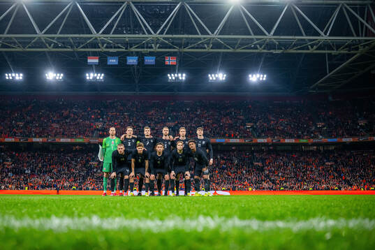 The starting eleven of Norway pose for a team photo
