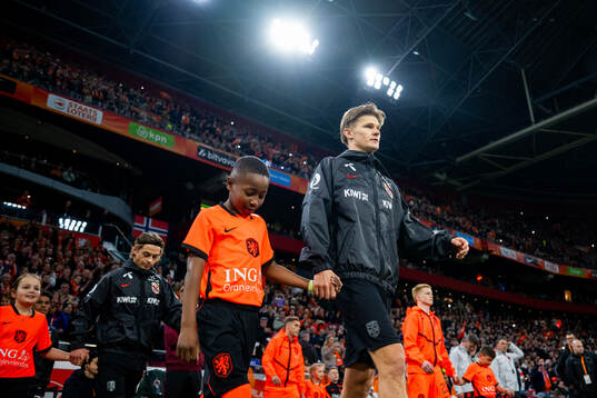 David Møller Wolfe of Norway enters the pitch