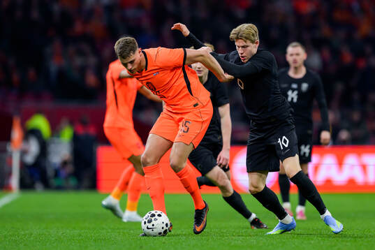 Micky van de Ven of Netherlands and Jens Petter Hauge of