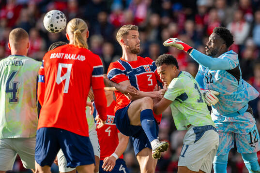 Kristoffer Ajer of Norway and goalkeeper Yvon Mvogo of