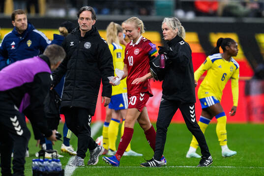 Pernille Harder of Denmark recieves medical attention