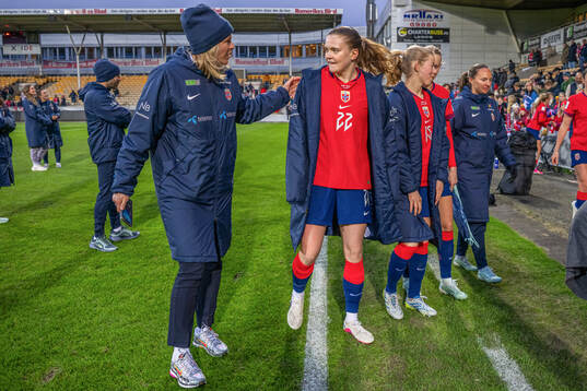 Press officer Carina Olset Hovda and Signe Gaupset of Norway