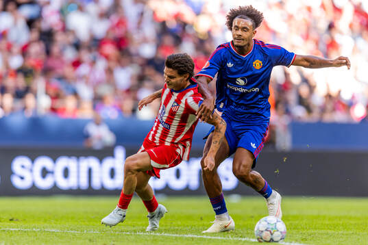 Arnau Sola of Atletico de Madrid and Altay Bayındır of