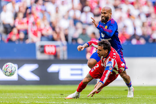 osé María Giménez of Atletico de Madrid and Bryan Mbeumo