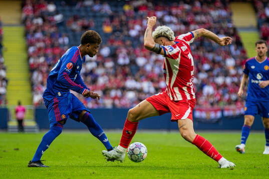 Amad of Manchester United and Matteo Ruggeri of Atletico de
