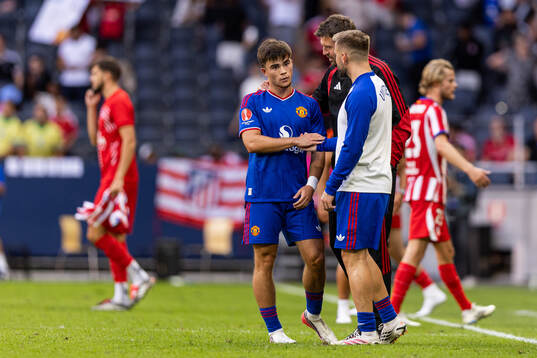 Harry Amass and Michael Carrick of Manchester United