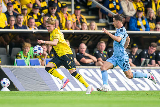 Jeppe Kjaer of Mjällby and Artur Gajdos of Slovan