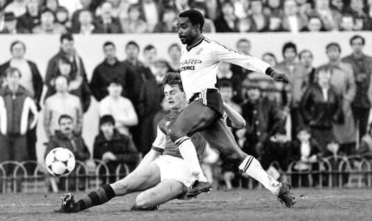  Laurie Cunningham of Manchester United against Colin Hill of Arsenal.