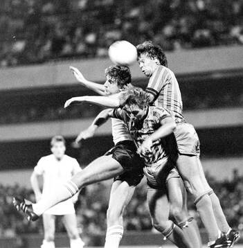  Mark Falco of Tottenham in an air duel.