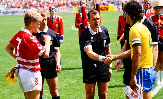  Swedish referee Erik Fredriksson. Denmarks Morten Olsen left.   