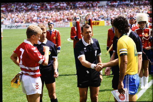  Swedish referee Erik Fredriksson. Denmarks Morten Olsen left.   
