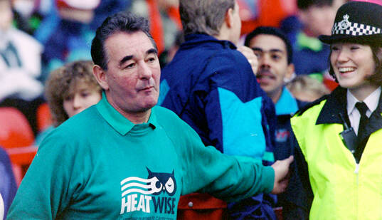  Nottinghams manager Brian Clough with a police woman.
